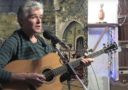 Performer Charlie Burton playing guitar