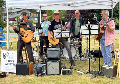 3 Bits Worth The band called 3 Bits Worth - five musicians at a farm market